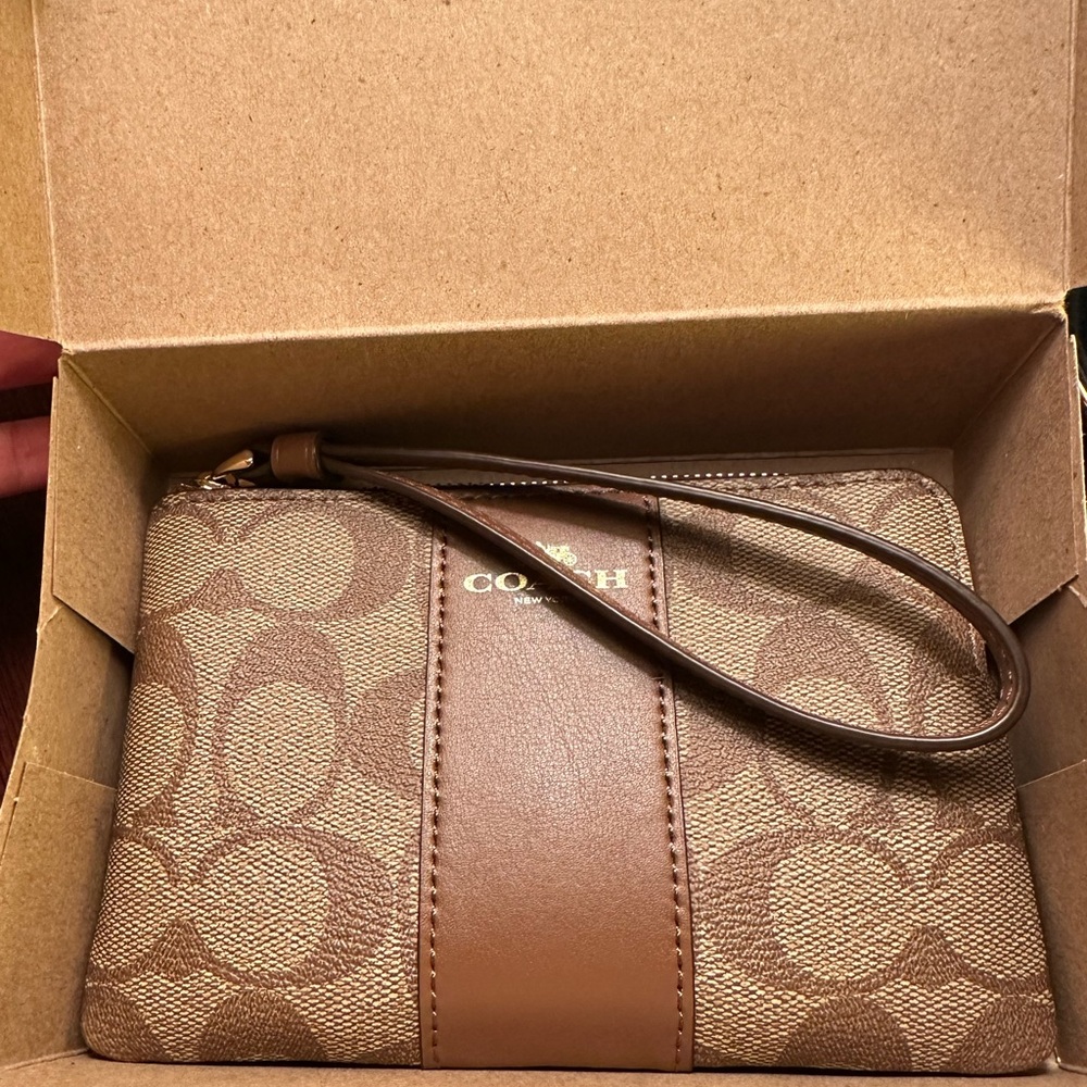 Brand new in box w tags, classic coach wristlet.